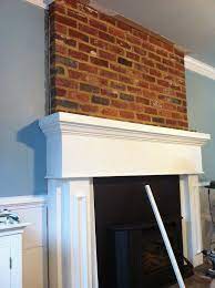 brick fireplace by crown molding