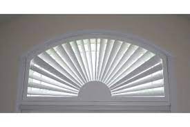 A curved top window in a wall or an eyebrow dormer; Arched Sunburst Poly Shutters From Direct Buy Blinds