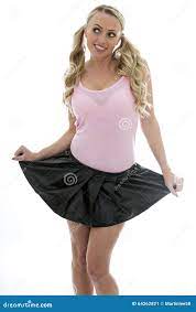 Beautiful Young Caucasian Woman Lifting Up Her Mini Skirt Smiling and  Looking Stock Image - Image of flirting, blond: 64262821