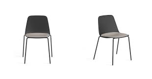 A squarish seat and a tall curved fullback are covered in black meshy fabric. Maarten Plastic Four Legs Viccarbe