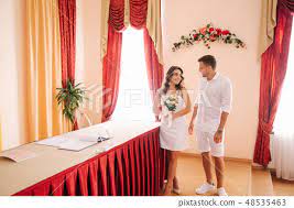 bride standing inside marriage house