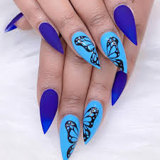 bright erfly nails topped with