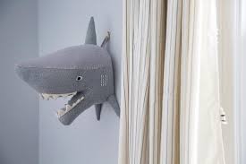 gray boy room with felt shark head on