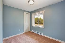 small light blue bedroom in empty house