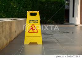 yellow caution slippery wet floor sign