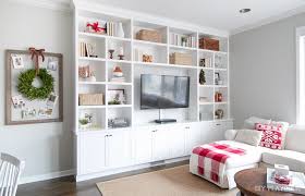 See how a few easy styling choices can completely transform a room. How To Decorate Your Built In Shelves For The Holiday Season