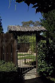 Metal Gate With Thatched Roof