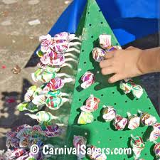 I already decorate a huge candy themed christmas tree, and chandelier in my dining area, but i really wanted to add in a garland. Carnival Game And Booth Ideas Lollipop Tree Carnival Game