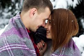 cute couple kissing in the snow photos