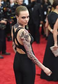 Delevingne has several amazing tattoos on her body. Cara Delevingne Got Tattoo Sleeves For The Met Gala Celebrity Tattoos Full Sleeve Tattoos Cara Delevingne