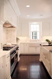 white kitchen and dark floors