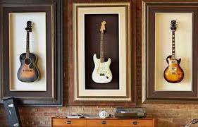 hanging a guitar on the wall