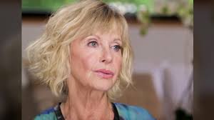 Officer of the order of the british empire (obe) by queen elizabeth ii. Olivia Newton John Gives Fans Long Awaited Cancer Update Classic Country Music
