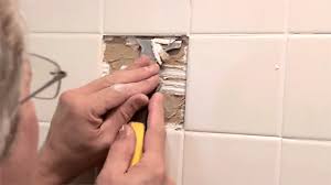 how to replace damaged shower surround tile