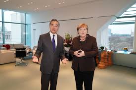 François hollande, and ukrainian pres. German Chancellor Angela Merkel Meets With State Councilor And Foreign Minister Wang Yi