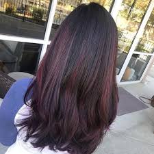 Long black hair with subtle red highlights next, we have another beautiful way to wear black hair with red highlights. 10 Dark Red Hair Colors That Are Trending This Year Southern Living