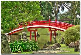 Red Bridge In The Japanese Garden In
