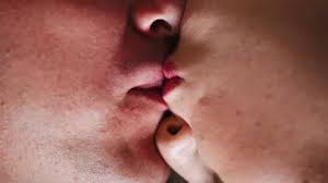gentle kiss of man and woman on lips