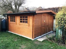 log cabin style shed installation in
