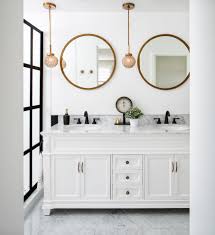 Double sink bathroom vanity cabinets are often mounted one above the other with space left for towels (and bottle traps) between. Round Bathroom Vanity Contemporary With Beach House Resistant Wall And Floor Tiles