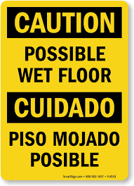 bilingual caution possible wet floor