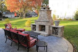A Patio With A Fireplace Fire Pit