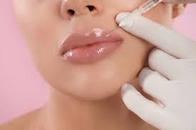 using lip plumping gloss