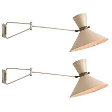 Modern Swing Arm Wall Sconce By Rene