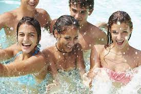 Teenage Friends In Swimming Pool Stock Photo by ©monkeybusiness 64582513