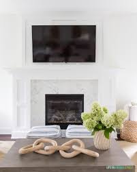 If you have a fireplace in your living room, the chances are that you've considered placing a tv above your fireplace, but where do you put your cable box? Mounting Your Tv Over A Fireplace Design Inspiration Driven By Decor