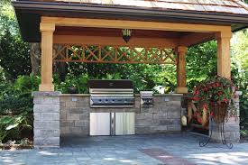 covered bbq area with natural stone