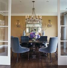 Interior view of modern dining room with table, chairs and stairs. 20 Beautiful Dining Rooms With Velvet Chairs