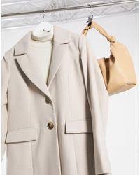 More than 216 products in stock. River Island Camel Collarless Longline Coat Lyst