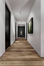 Well, you definitely can't judge people through their taste in interior design. Room Designs With Wood Floor Wood Doors Interior Corridor Design House Design