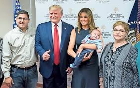Image result for Images of Donald Trump posing with baby in El Paso hospital