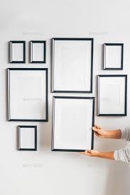Multiple Many Black Picture Frames On