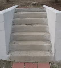 concrete stairs between block wa