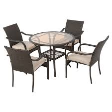 It includes one table and four chairs, all made in the usa and crafted from metal in a colorful neutral hue. Bailey Wicker 5 Piece Round Patio Dining Set With Cushion Hayneedle