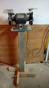 The amazing belt grinder design from jeremy schmidt. Made This Bench Grinder Stand From Scrap Lumber I Put A Lag Bolt In Under Each Leg So I Can Level It On The Co Bench Grinder Stand Grinder Stand Bench