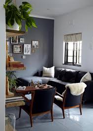 black sofa with blue chairs interior