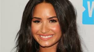 Demi has a tanned complexion with golden undertones and dark brown eyes. Demi Lovato Debuted Blonde Hair Is Summergoals Hellogiggles