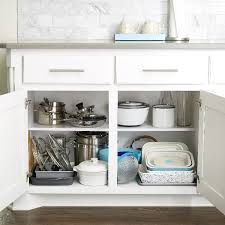 When i need to level old cabinet tops using the shims, i use a 6' level across the tops. How To Organize Your Kitchen Cabinets Step By Step Project The Container Store
