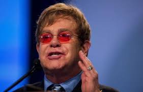 Elton John speaks at the 2012 international AIDS conference. (Jim Watson/AFP photo). John said that Bush, as well as other conservative politicians have ... - elton-john-afp