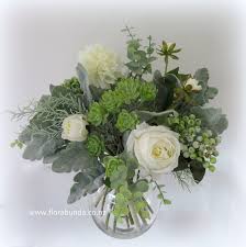 Glass Bowl Of Green And White Flowers