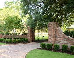 Rustic stone driveway columns punctuate the entrance to this great falls landscape. 11 School Entrance Ideas Driveway Entrance Brick Columns Entry Gates
