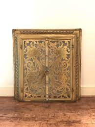 Brass Fireplace Doors In Frame With