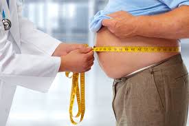 doctor mering obese man waist body