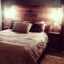 Pallet Headboard With Sconce Lighting And Shelves Bedroom