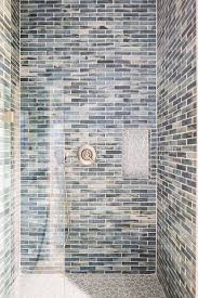 stacked blue glass shower tiles with