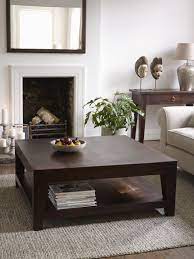 The coffee table, in this case, is the element which brings together a series of modern and traditional elements such as the fireplace mantel, the ceiling trims and that beautiful dark floor. Seba Dark Brown Square Coffee Table Furniture Coffee Table Lombok Furniture